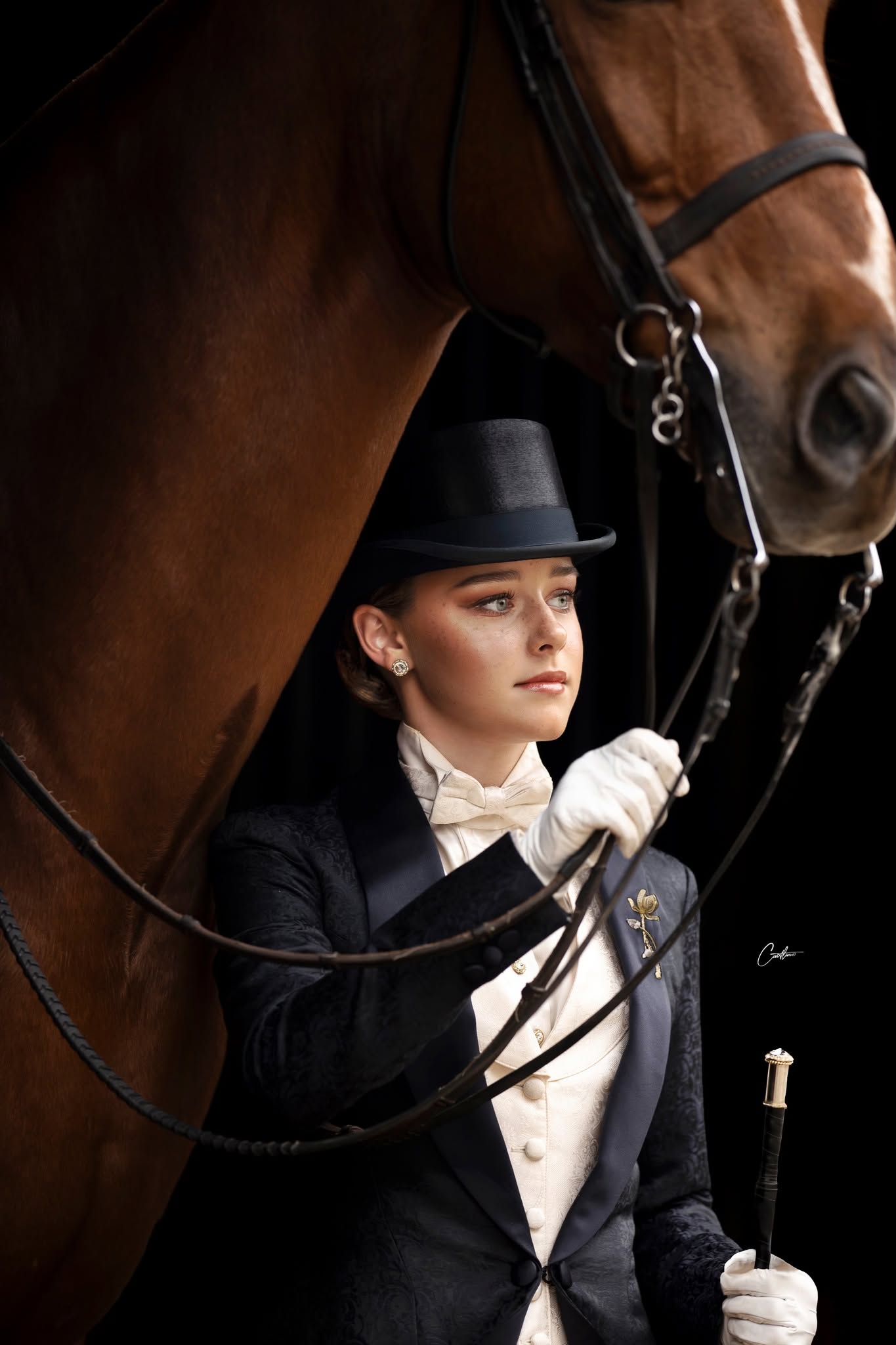 Formal equestrian portrait in black tie